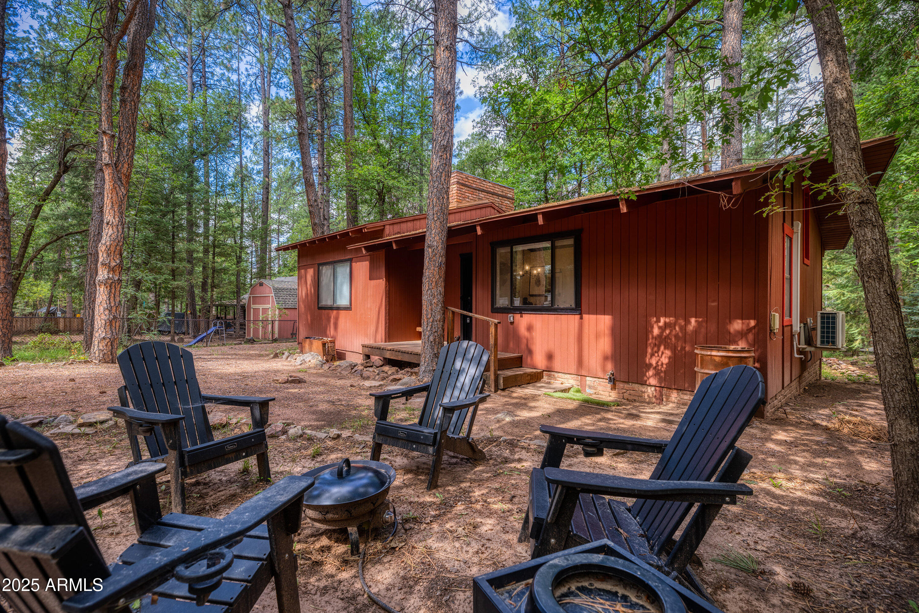 286 West Columbine Road Payson, AZ 85541 - Photo 2 of 17 a view of a patio with a table chairs and a backyard