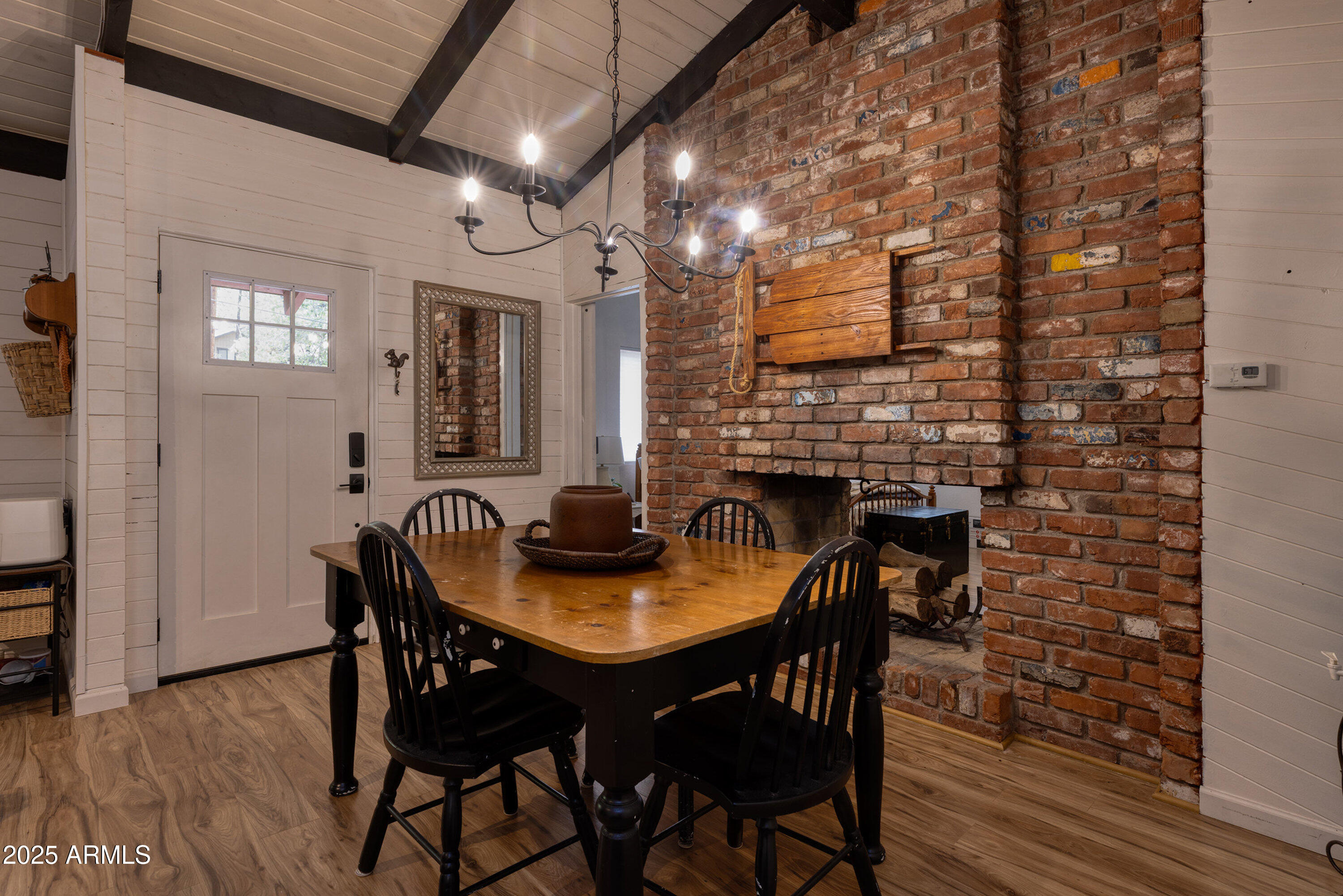 286 West Columbine Road Payson, AZ 85541 - Photo 7 of 17 a view of a dining room with furniture and wooden floor