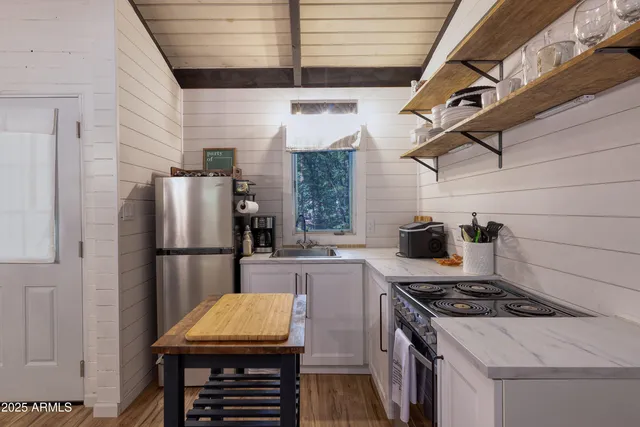 a kitchen with a stove a refrigerator and a stove