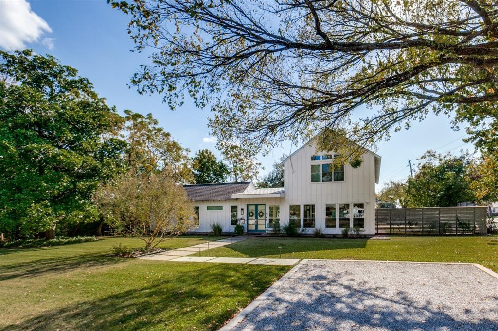 4206 Manning Lane Dallas, TX 75220 - Photo 2 of 35 a view of a house with garden and a trees