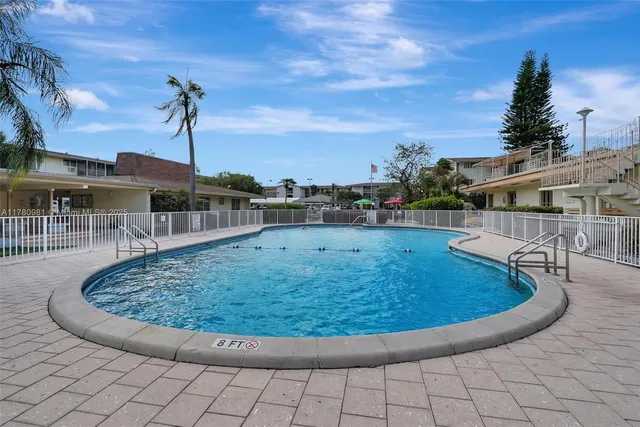 a patio with a table and chairs