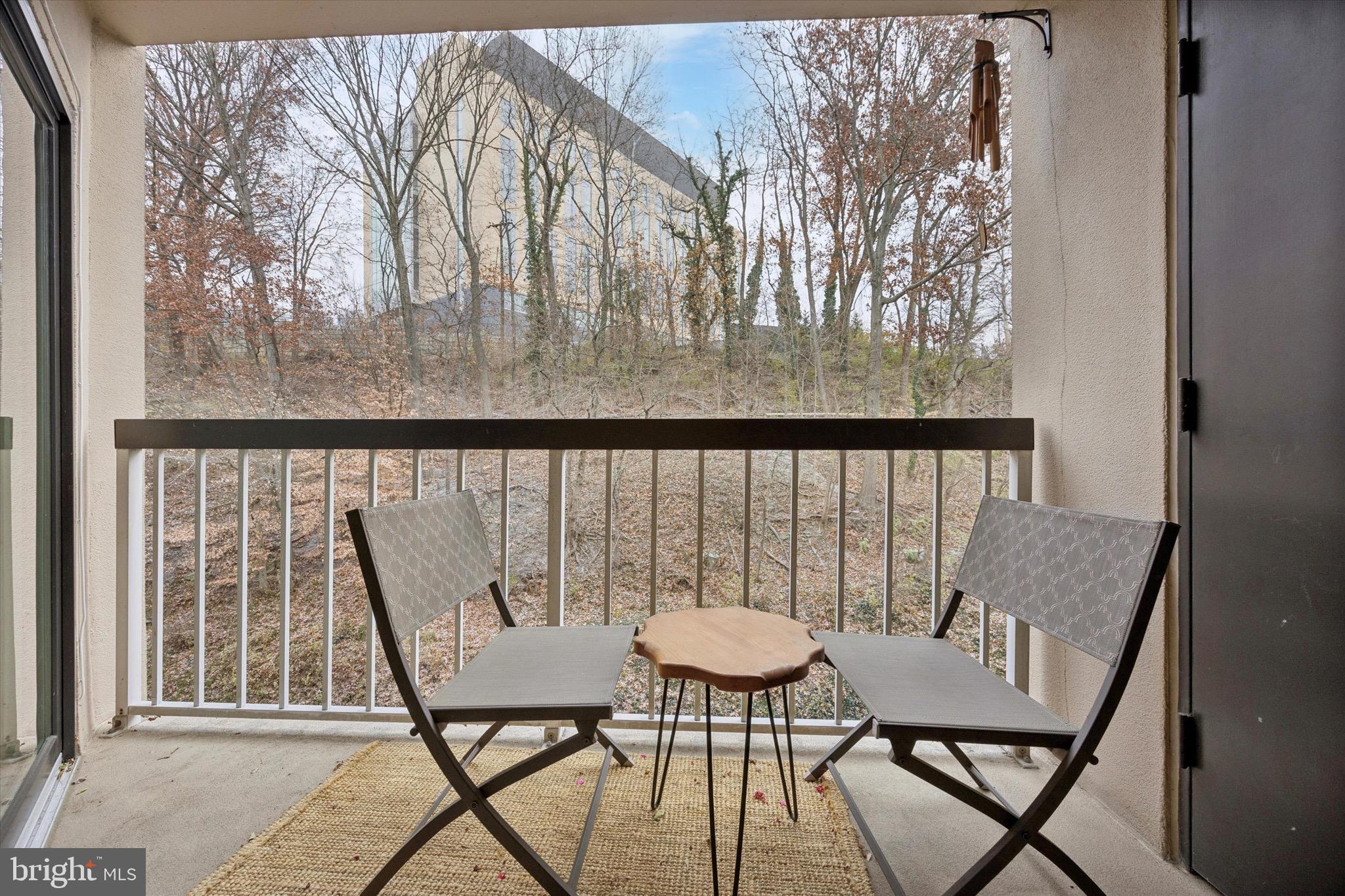 1704 North Park Drive, Unit A409 Wilmington, DE 19806 - Photo 20 of 25 a view of a balcony with table and chairs