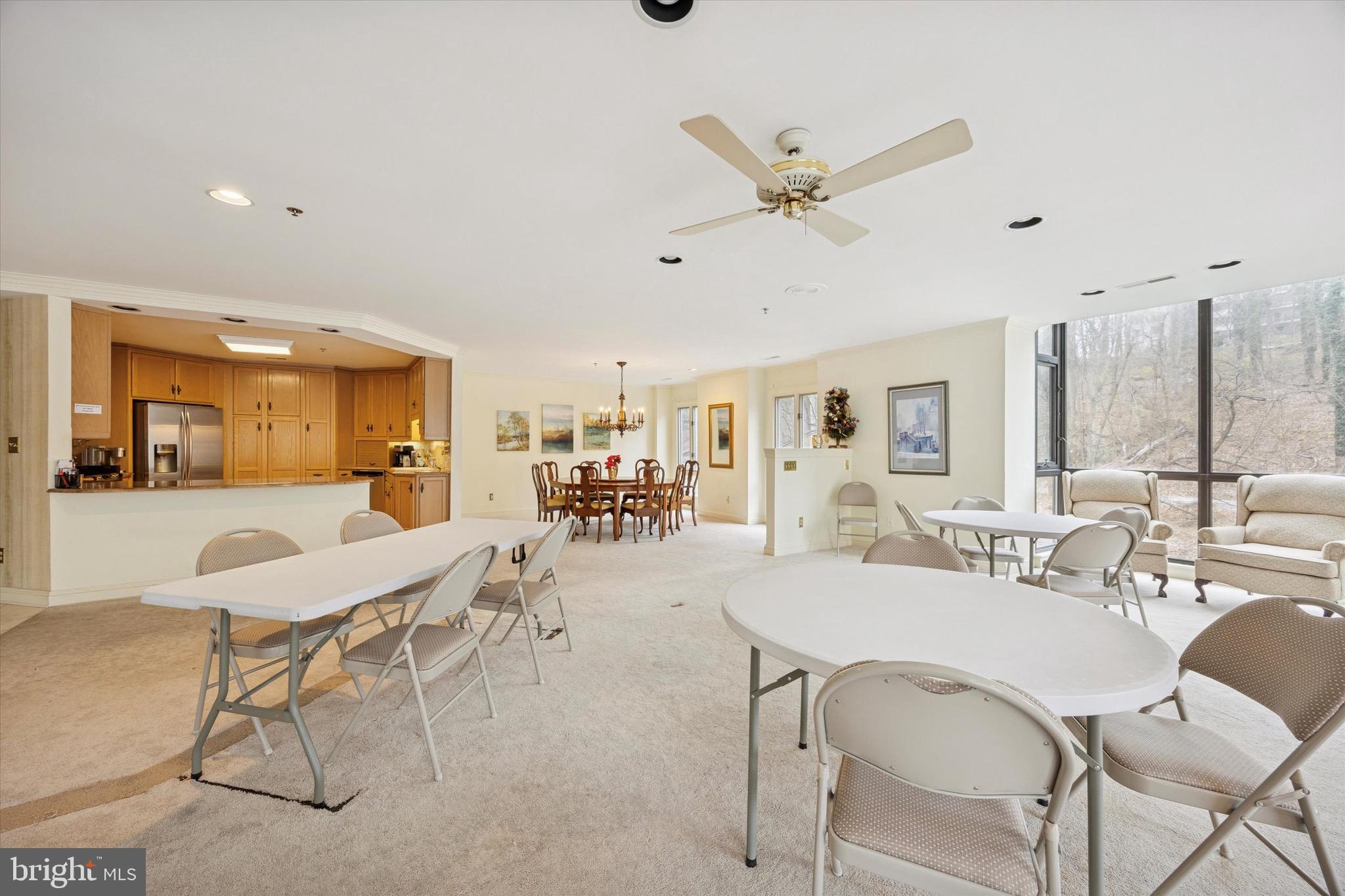 1704 North Park Drive, Unit A409 Wilmington, DE 19806 - Photo 24 of 25 a view of a dining room with furniture and a large window