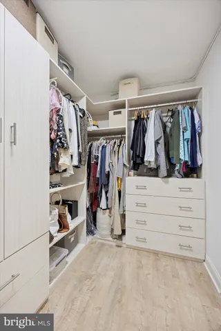 a spacious bedroom with a bed and a couch