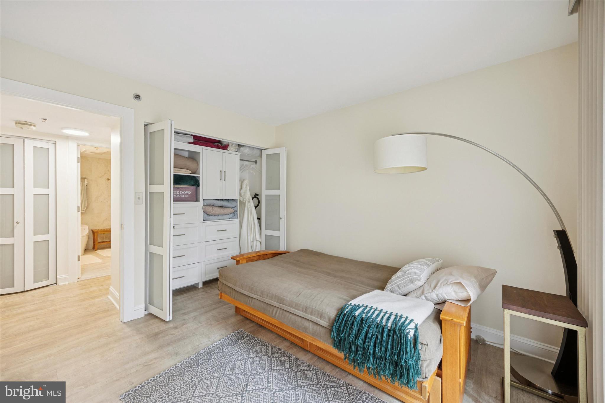 1704 North Park Drive, Unit A409 Wilmington, DE 19806 - Photo 9 of 25 a bedroom with furniture and natural light