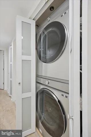 a kitchen with granite countertop a sink a stove and cabinets