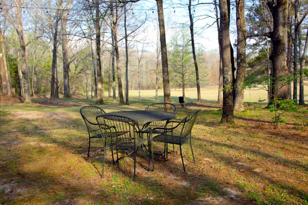 a view of a outdoor space with table and chairs