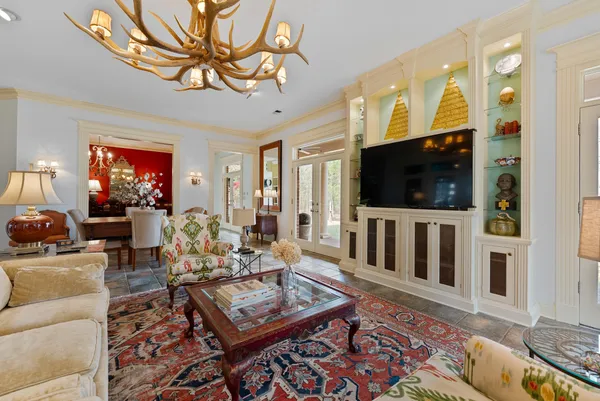 a living room with furniture and a flat screen tv