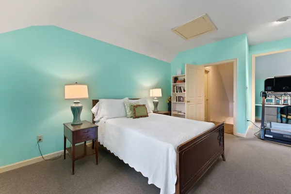 a bedroom with a bed and a tv in it