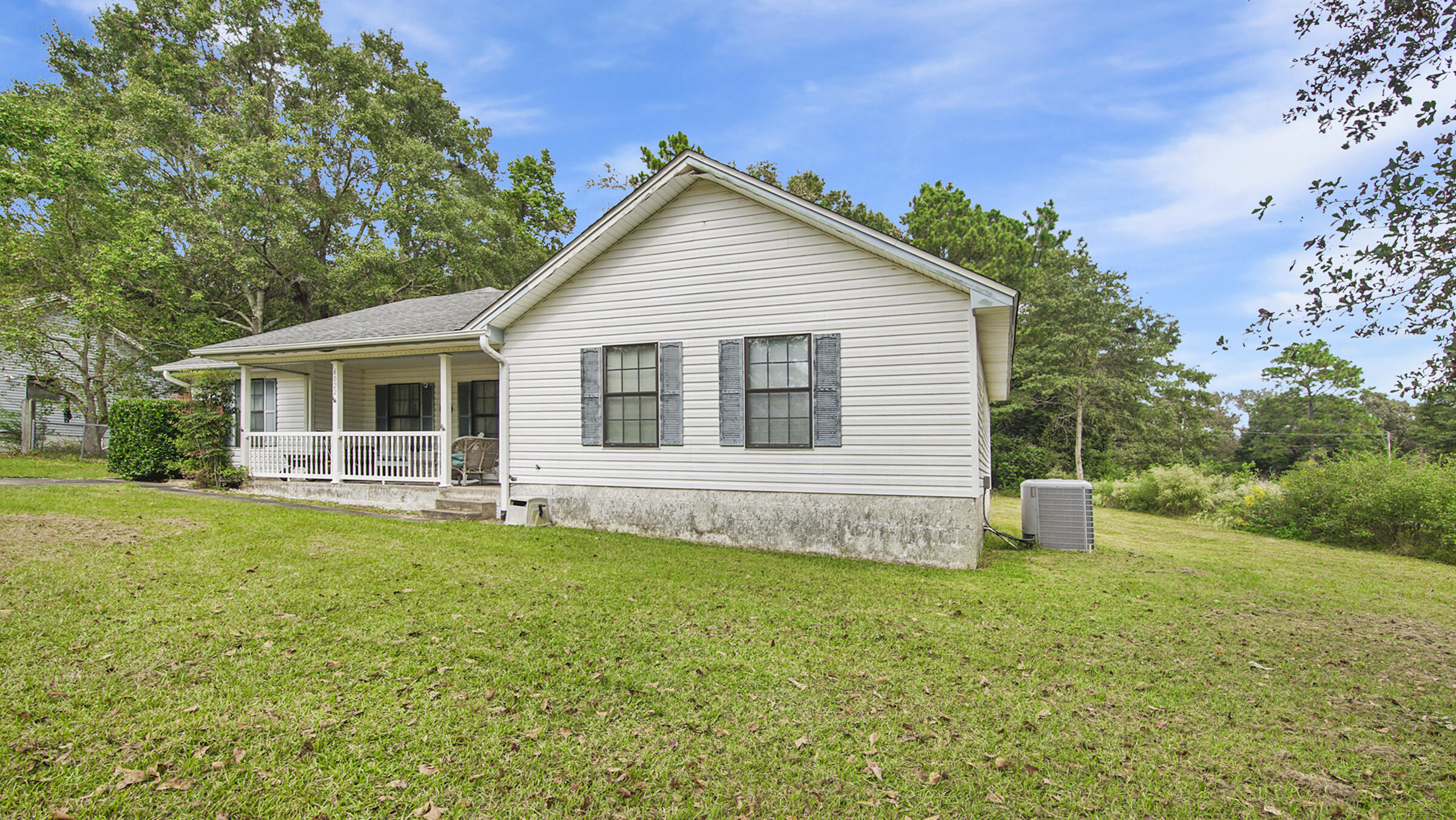 6022 Old Bethel Road Crestview, FL 32536 - Photo 2 of 19 a view of a house with a yard and porch