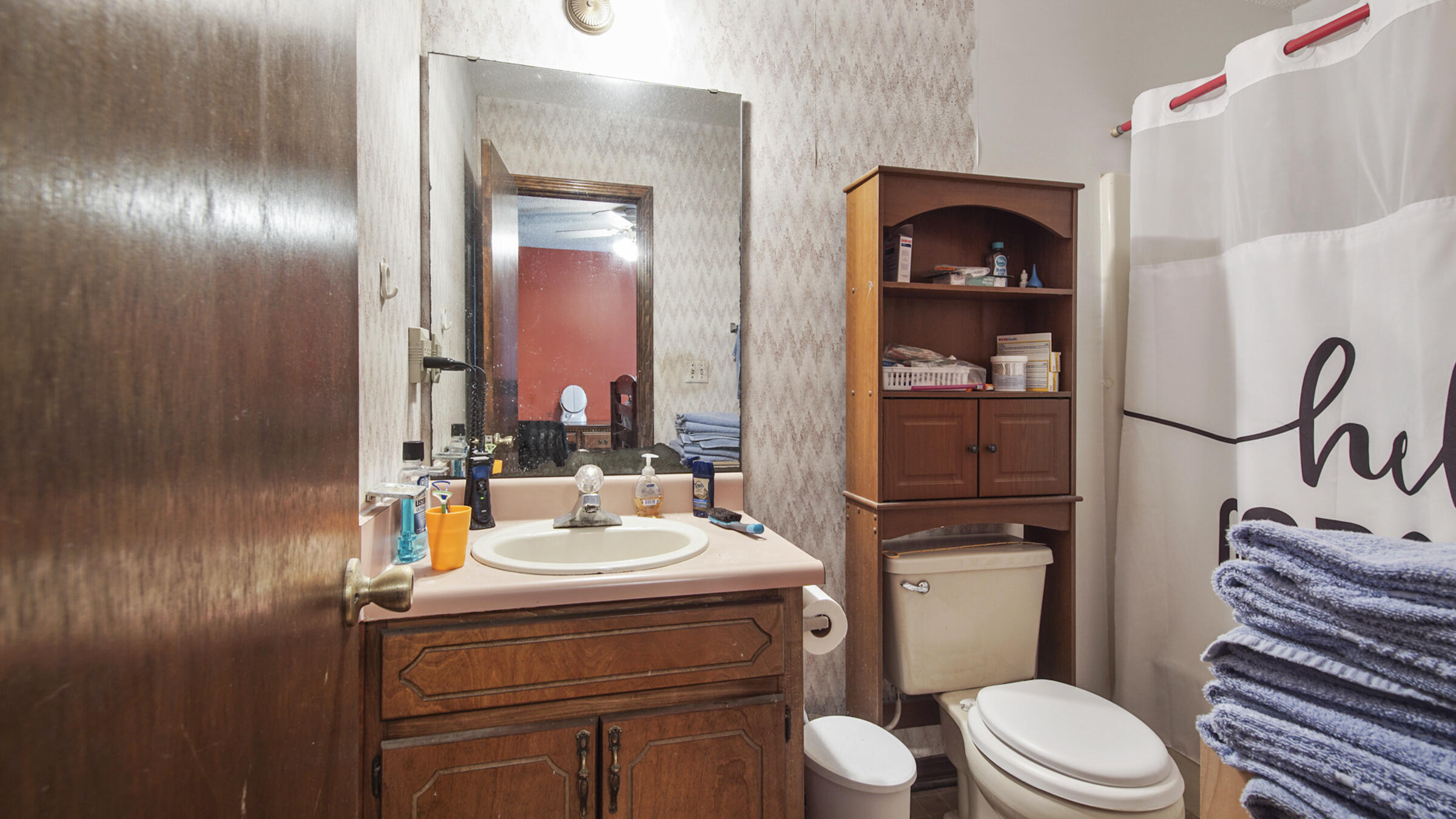 6022 Old Bethel Road Crestview, FL 32536 - Photo 15 of 19 a bathroom with a sink a toilet and shower curtain