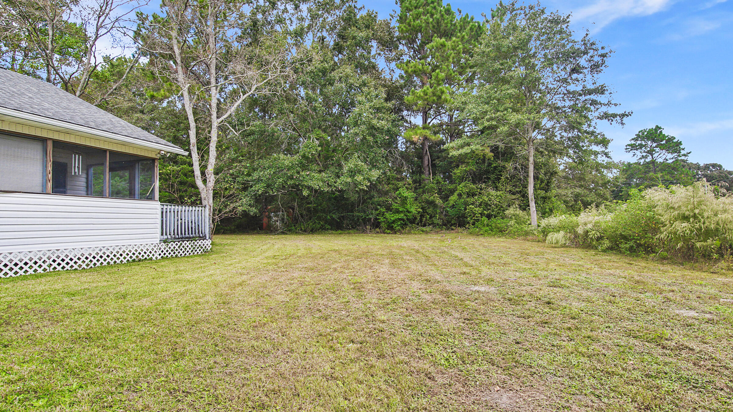 6022 Old Bethel Road Crestview, FL 32536 - Photo 17 of 19 a view of a backyard with large trees