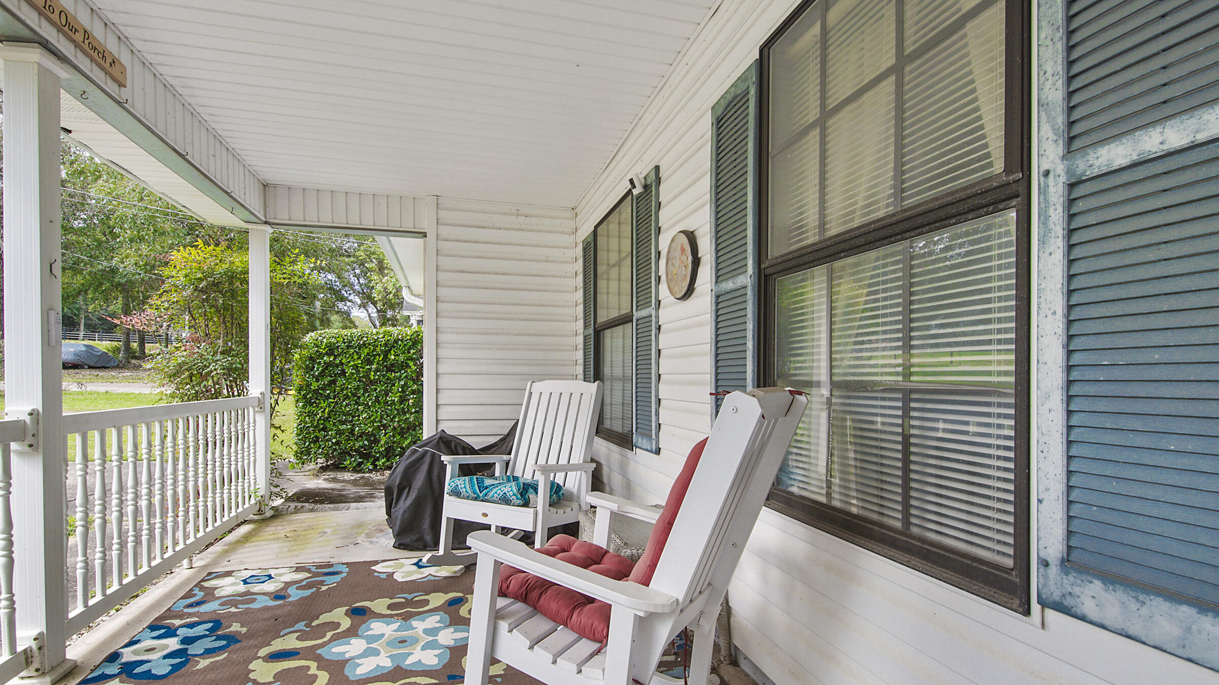 6022 Old Bethel Road Crestview, FL 32536 - Photo 3 of 19 a view of a patio with a table and chairs and wooden floor