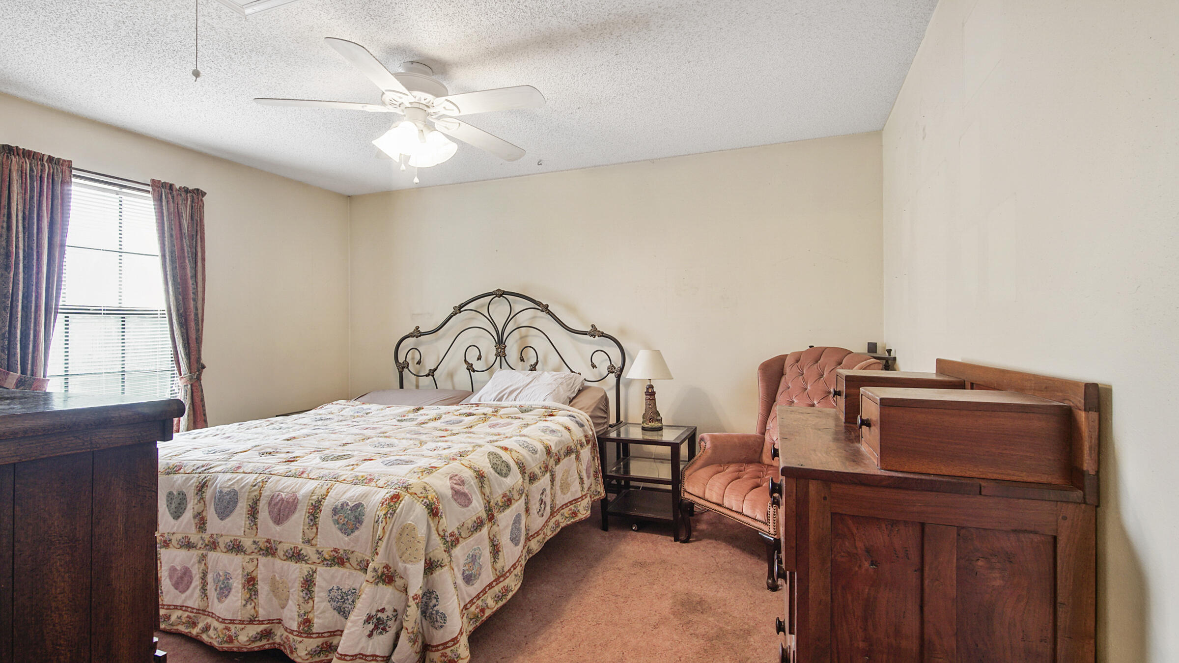 6022 Old Bethel Road Crestview, FL 32536 - Photo 6 of 19 a bedroom with a bed and a chandelier