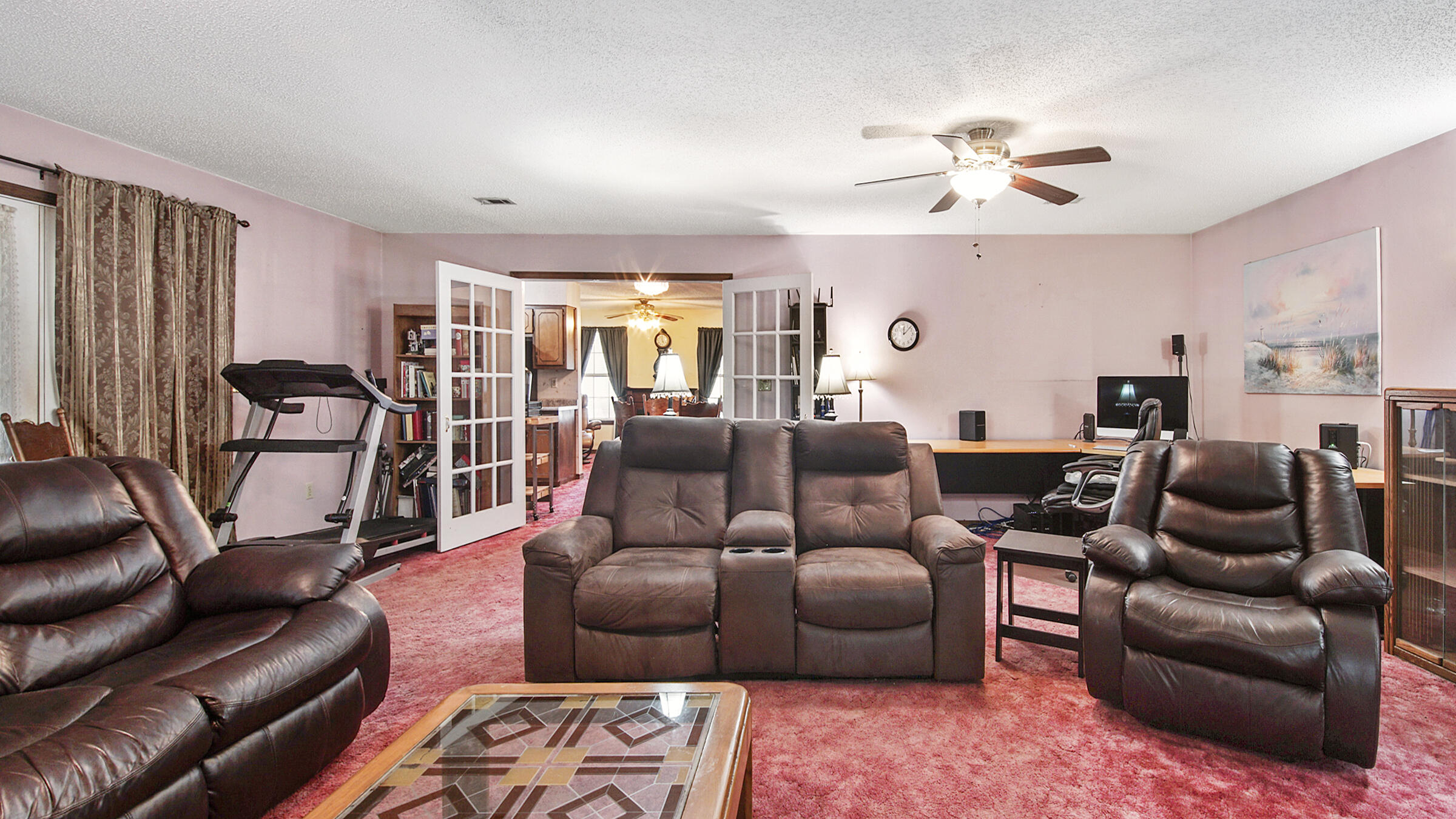6022 Old Bethel Road Crestview, FL 32536 - Photo 10 of 19 a living room with furniture ceiling fan and a rug