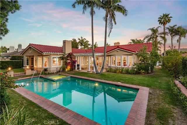 a front view of house with yard and outdoor seating