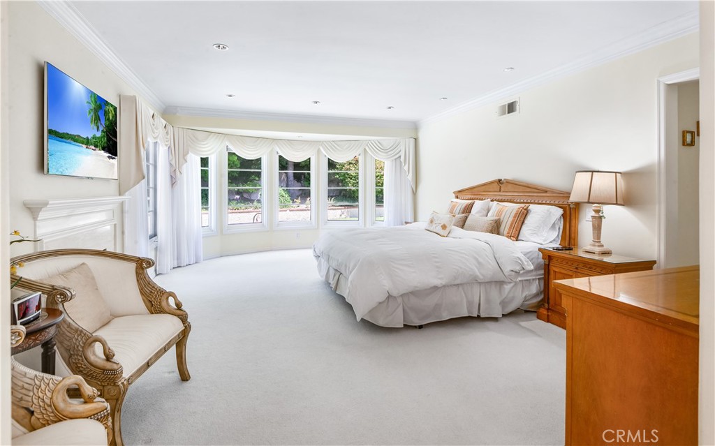 29 Santa Barbara Drive Rancho Palos Verdes, CA 90275 - Photo 12 of 17 a bedroom with a bed and glass window
