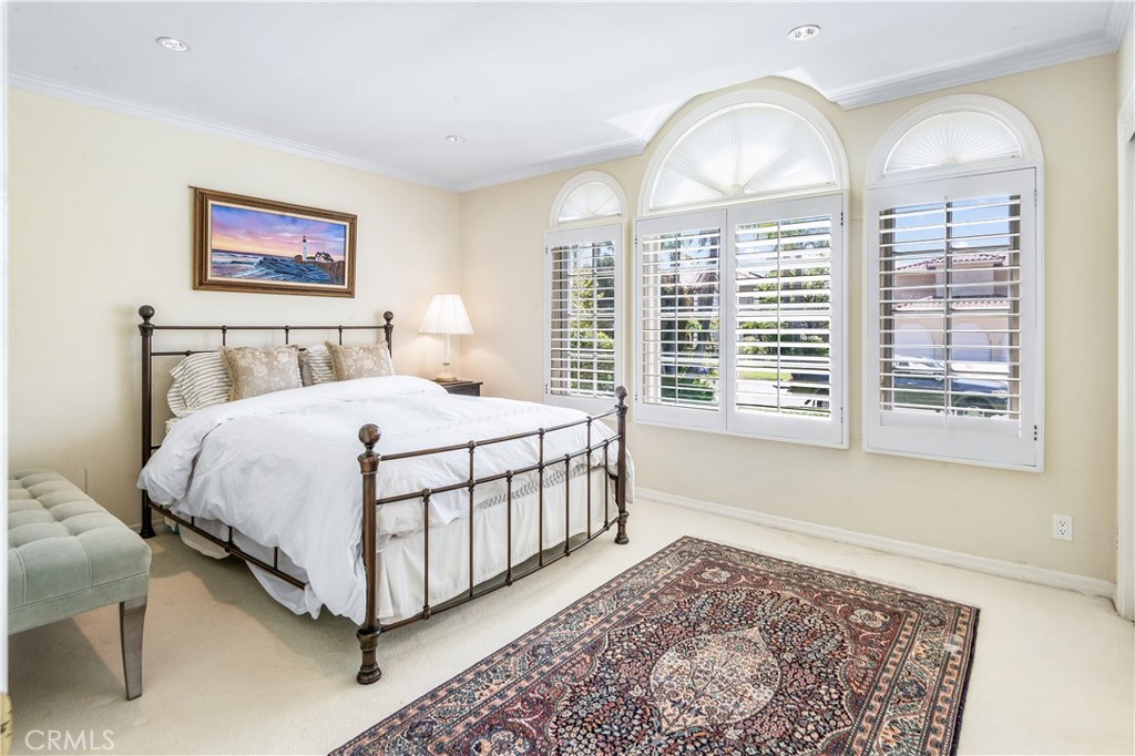 29 Santa Barbara Drive Rancho Palos Verdes, CA 90275 - Photo 16 of 17 a bedroom with a large bed and a window
