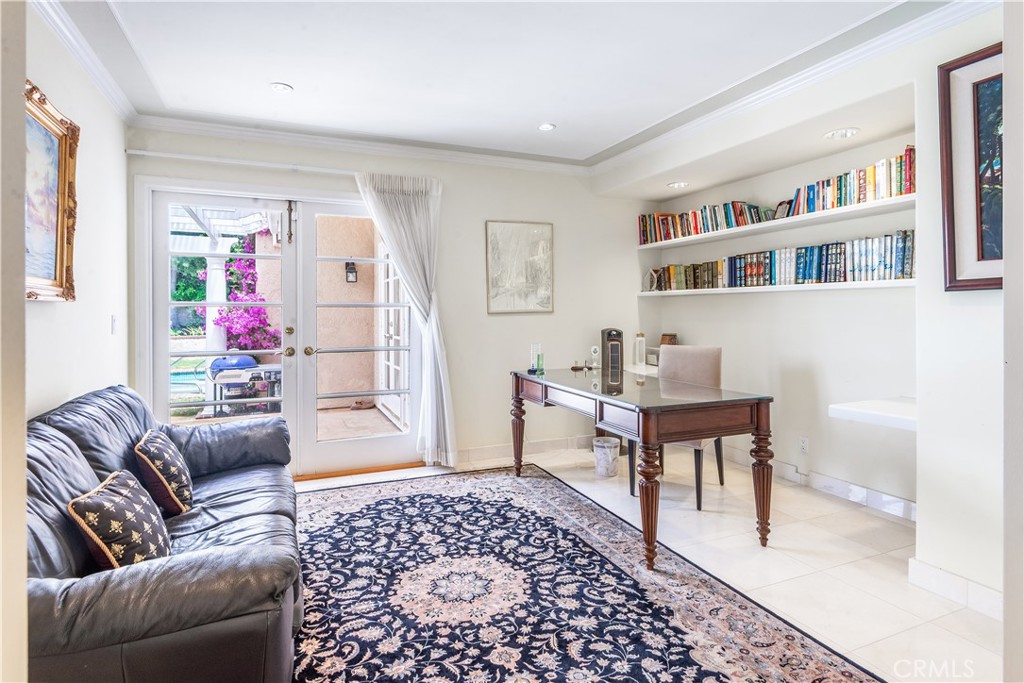 29 Santa Barbara Drive Rancho Palos Verdes, CA 90275 - Photo 17 of 17 a living room with furniture and a book shelf