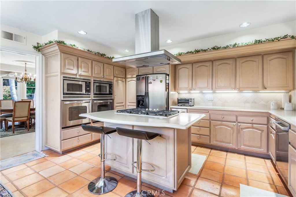 29 Santa Barbara Drive Rancho Palos Verdes, CA 90275 - Photo 4 of 17 a kitchen with stainless steel appliances granite countertop a stove and cabinets