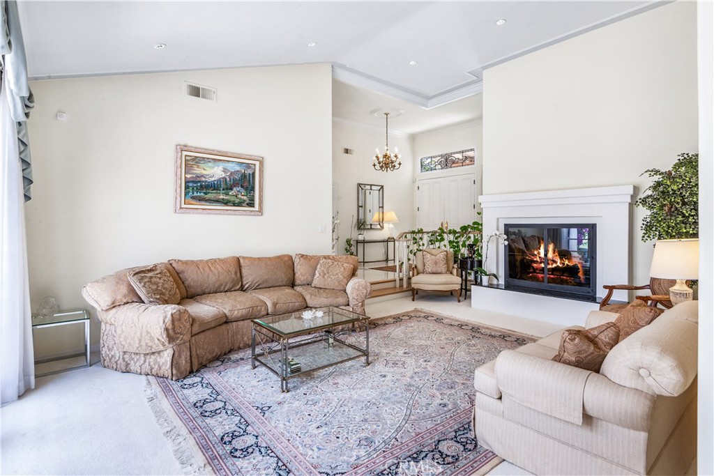 29 Santa Barbara Drive Rancho Palos Verdes, CA 90275 - Photo 5 of 17 a living room with furniture and a fireplace