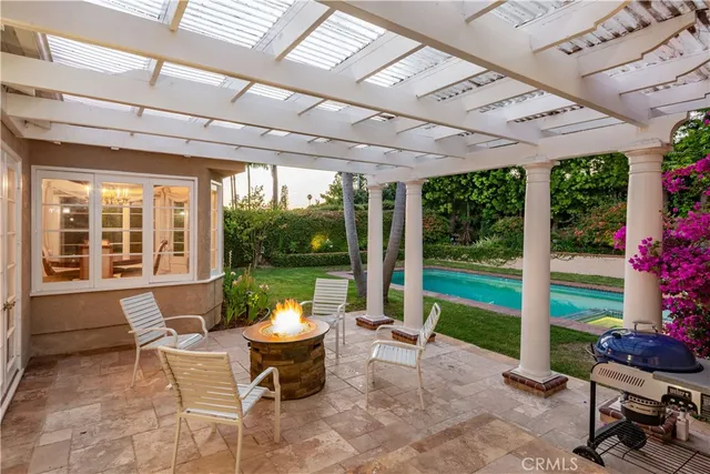 a view of a patio with a table and chairs