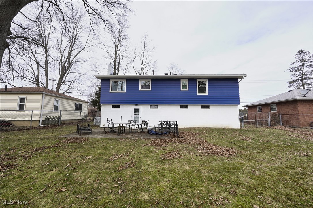 2674 Smith Road Fairlawn, OH 44333 - Photo 29 of 31 Rear view of property featuring a yard, a patio, and a fenced backyard