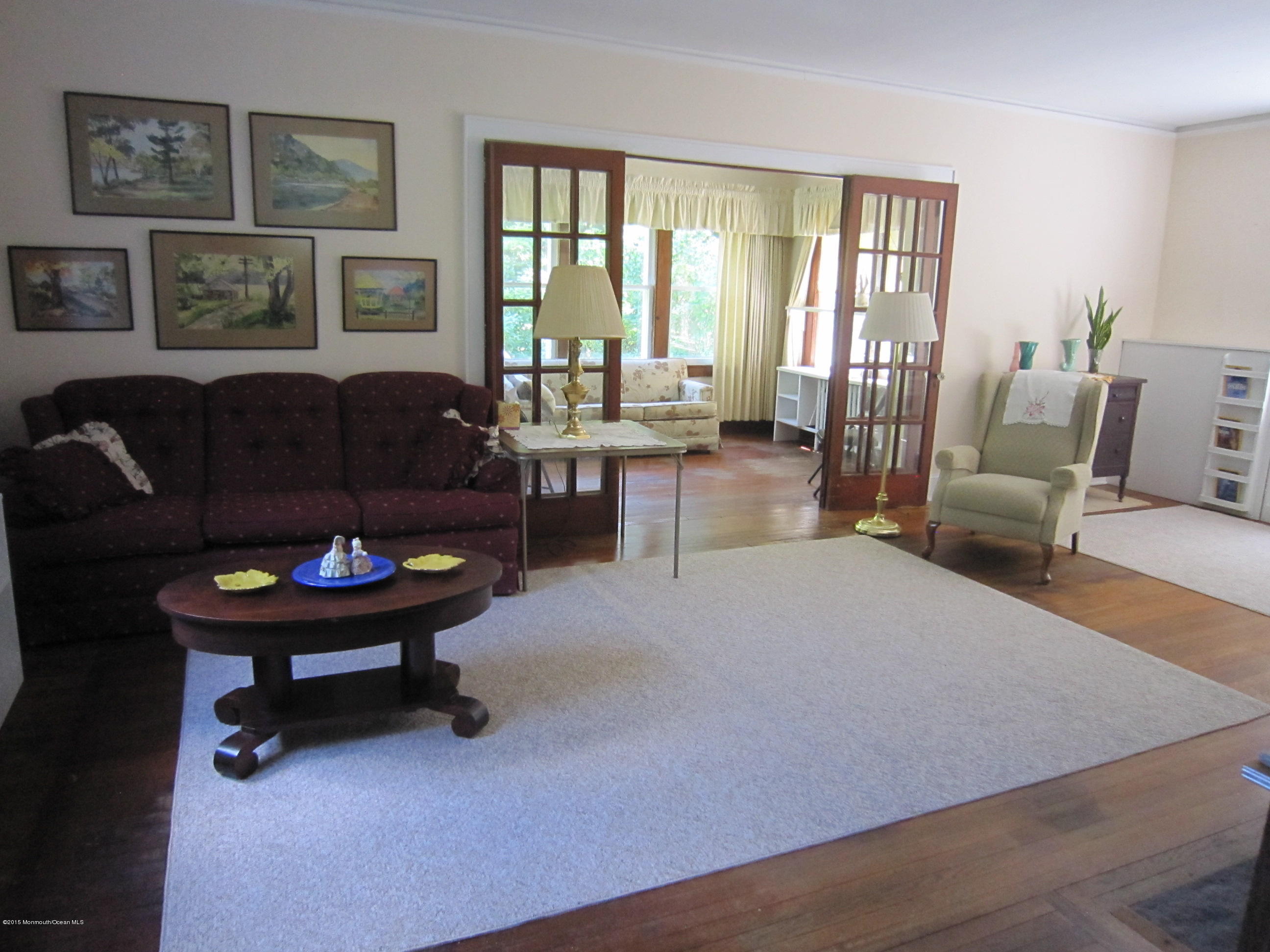 482 Brickyard Road Freehold, NJ 07728 - Photo 11 of 17 a living room with furniture and a large window