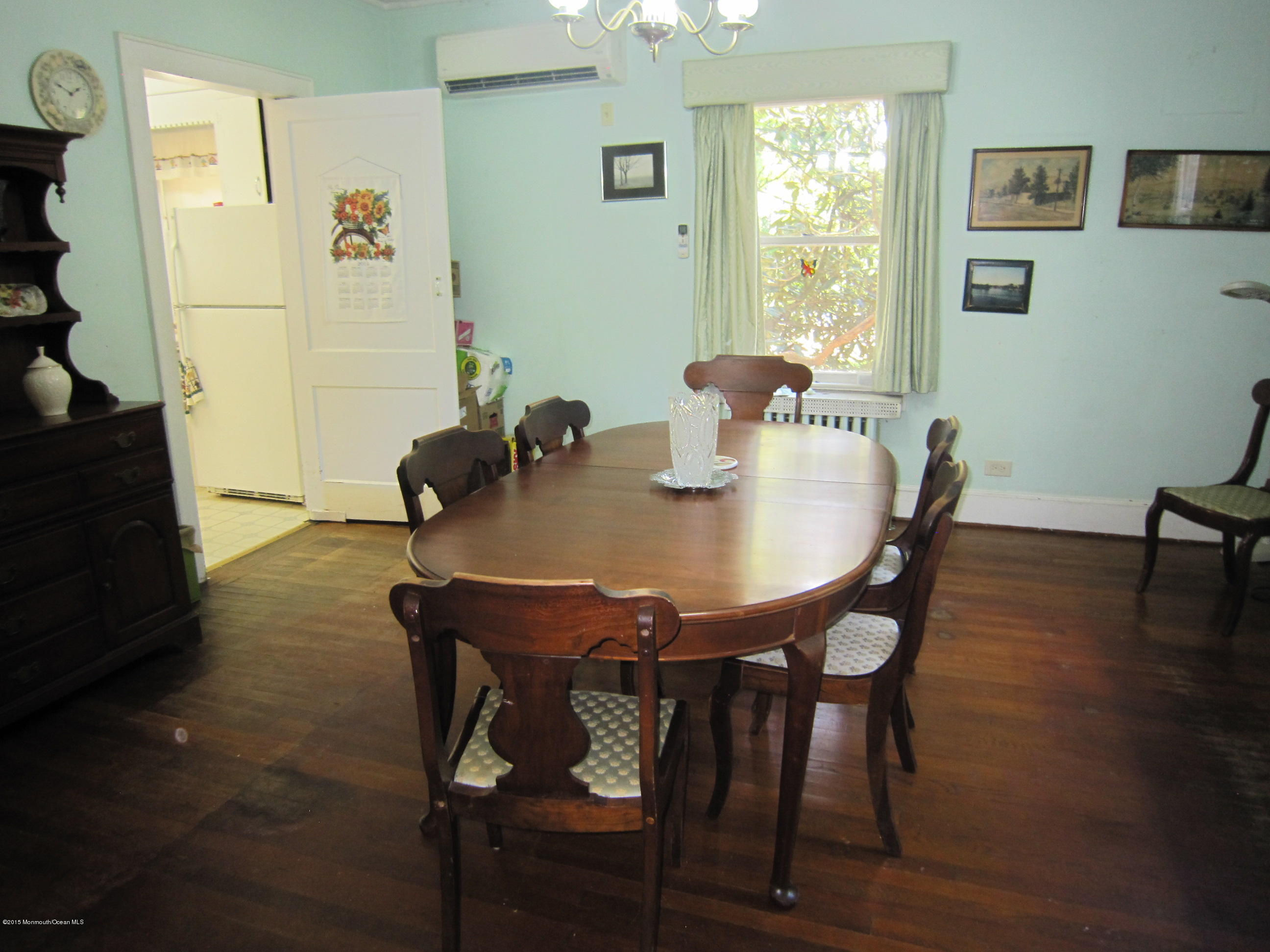 482 Brickyard Road Freehold, NJ 07728 - Photo 14 of 17 a view of a dining room with furniture and wooden floor