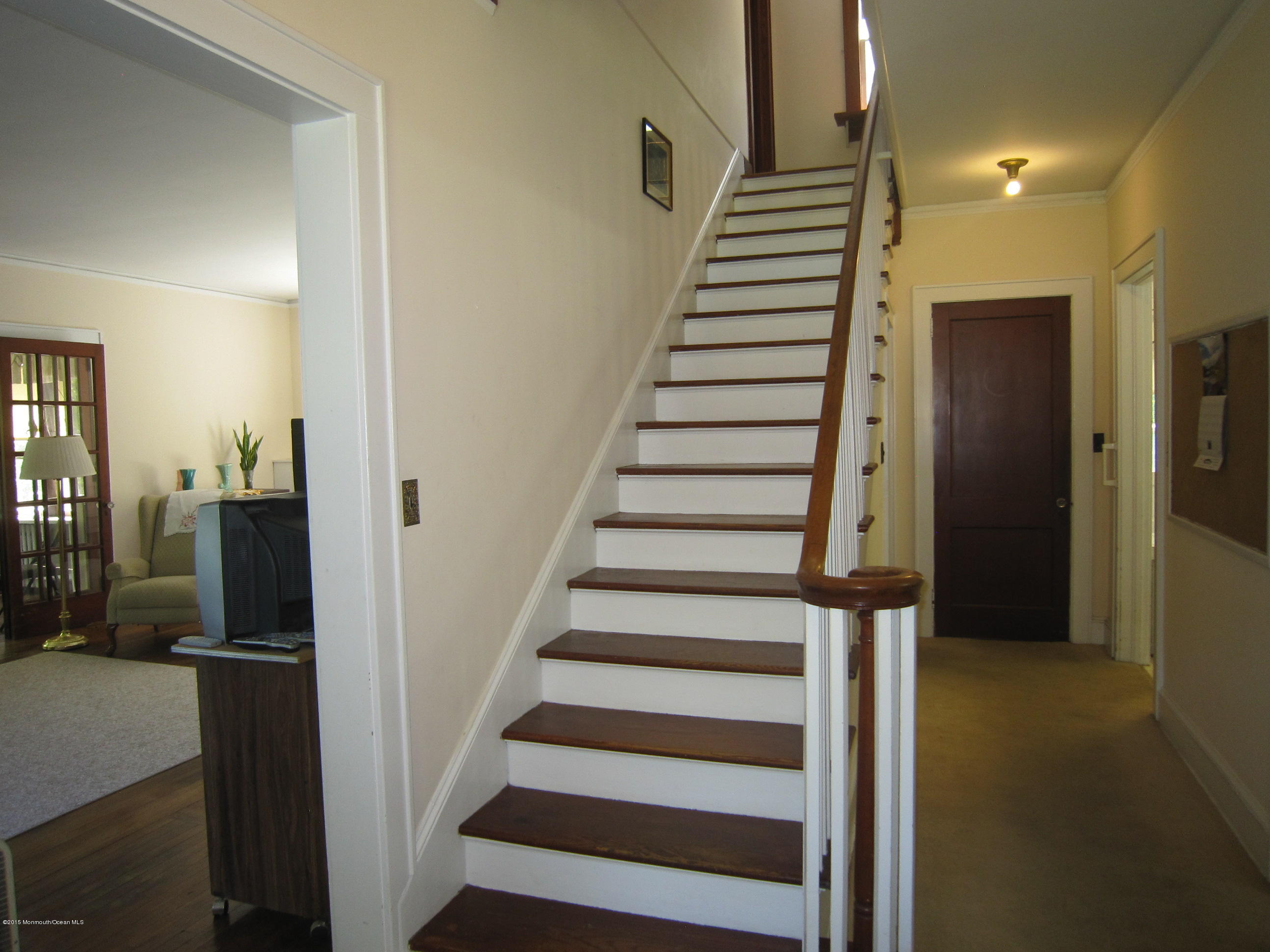 482 Brickyard Road Freehold, NJ 07728 - Photo 15 of 17 a view of entryway with wooden floor and stairs