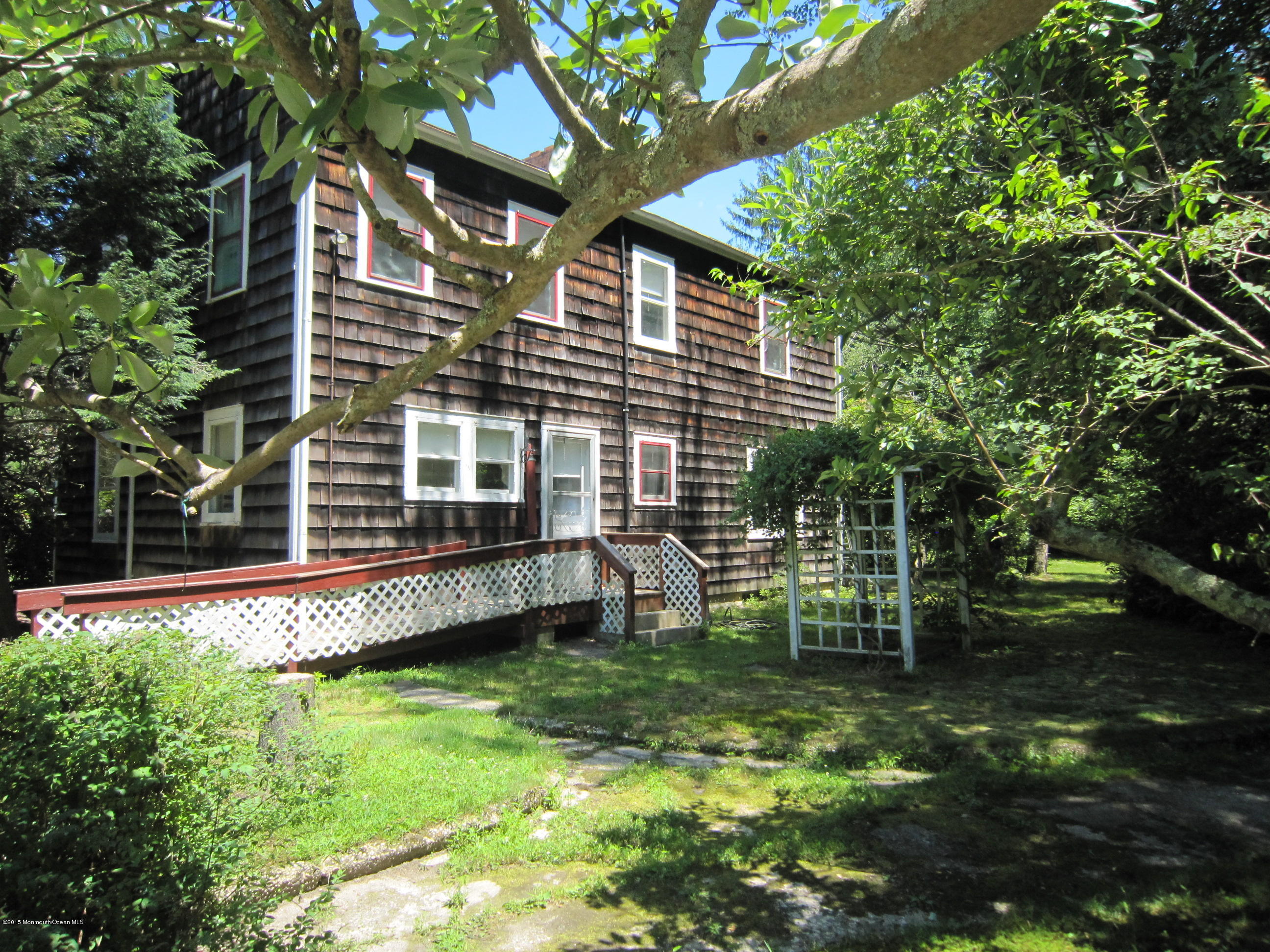 482 Brickyard Road Freehold, NJ 07728 - Photo 9 of 17 a view of a house with backyard and sitting area