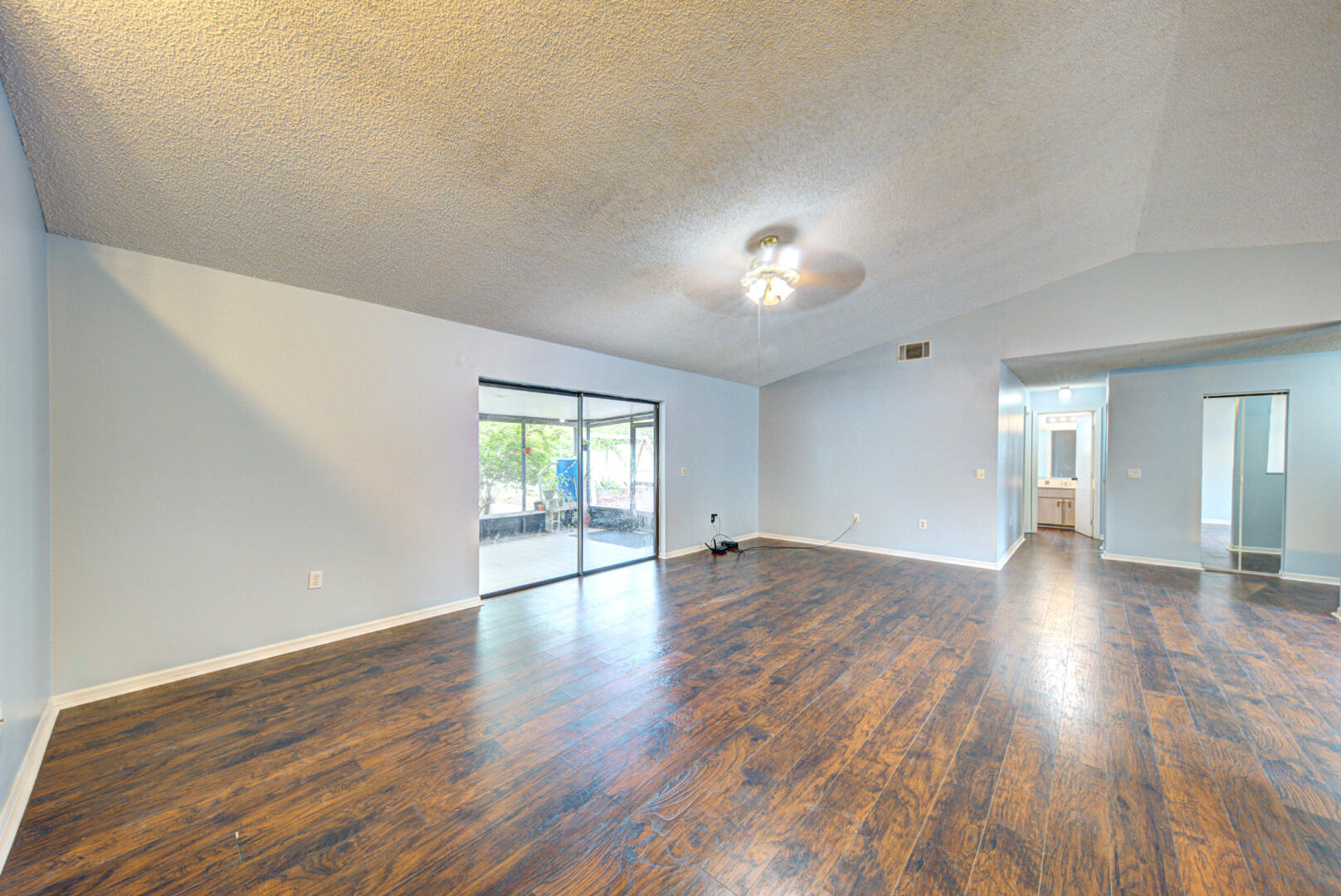 2423 Jaywood Road Titusville, FL 32780 - Photo 15 of 37 a view of empty room with wooden floor and fan