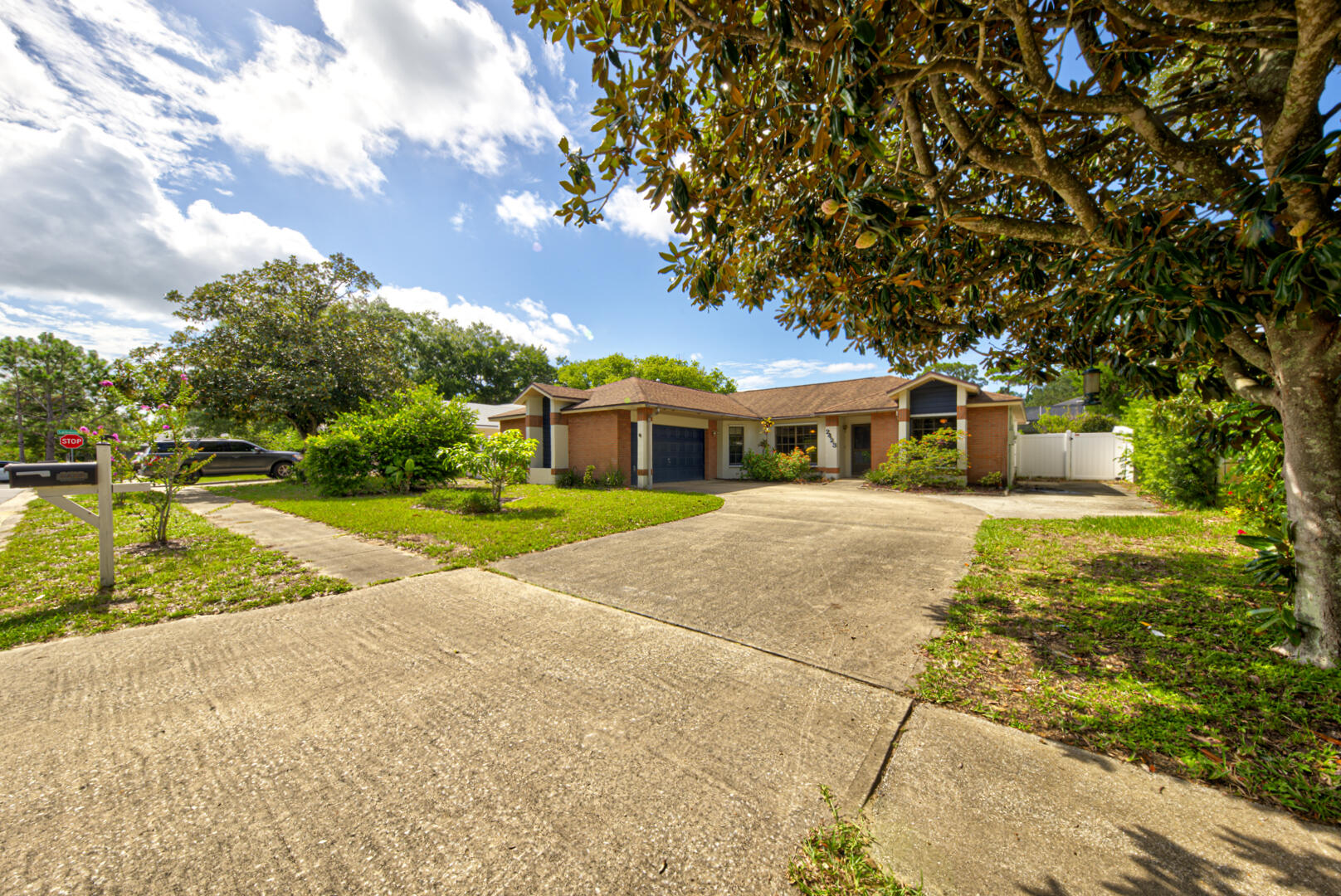 2423 Jaywood Road Titusville, FL 32780 - Photo 2 of 37 a front view of house with yard and green space