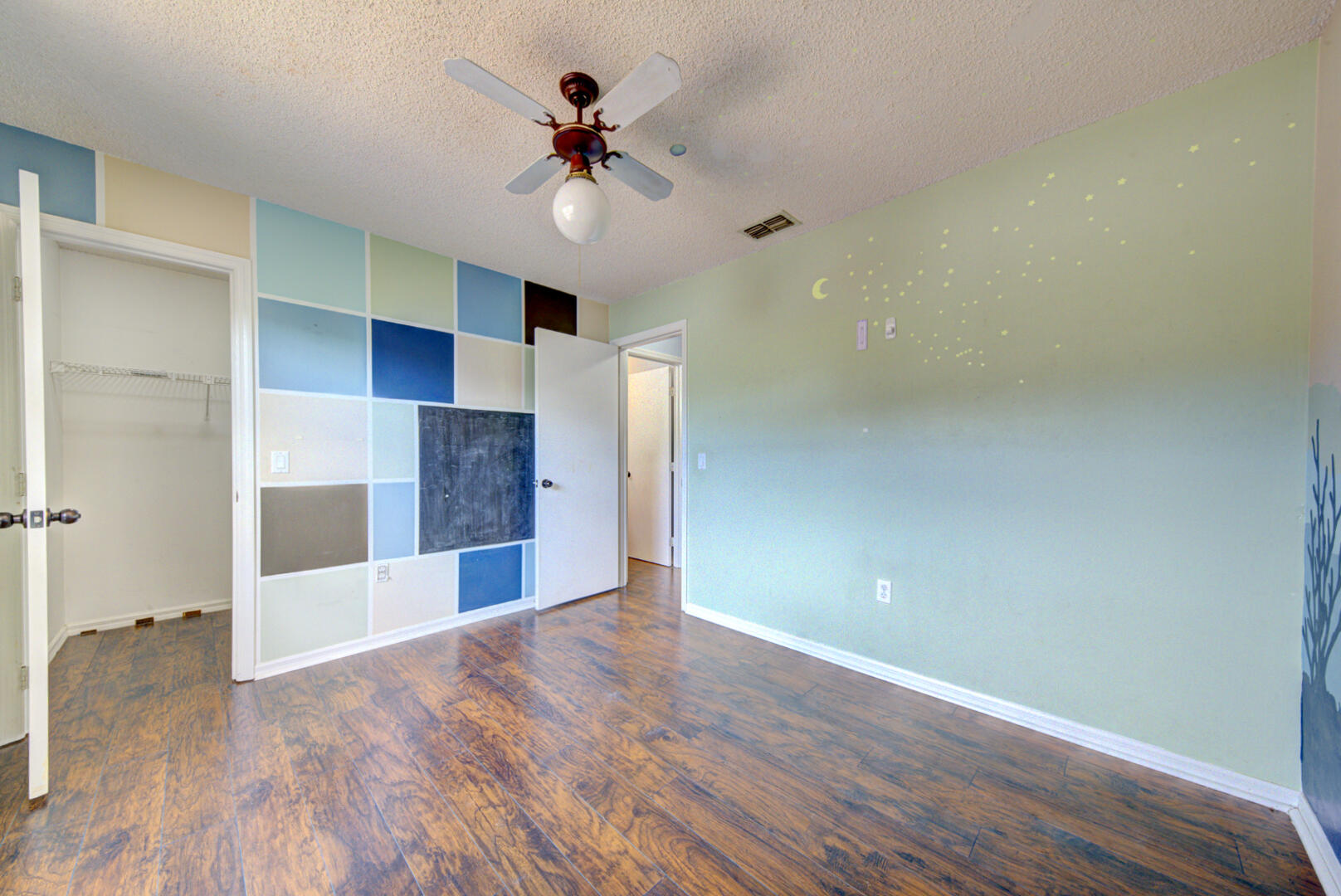 2423 Jaywood Road Titusville, FL 32780 - Photo 21 of 37 a view of empty room with wooden floor and fan