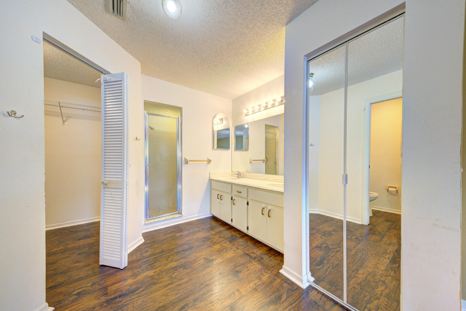 2423 Jaywood Road Titusville, FL 32780 - Photo 25 of 37 a bathroom with a glass shower door and a sink