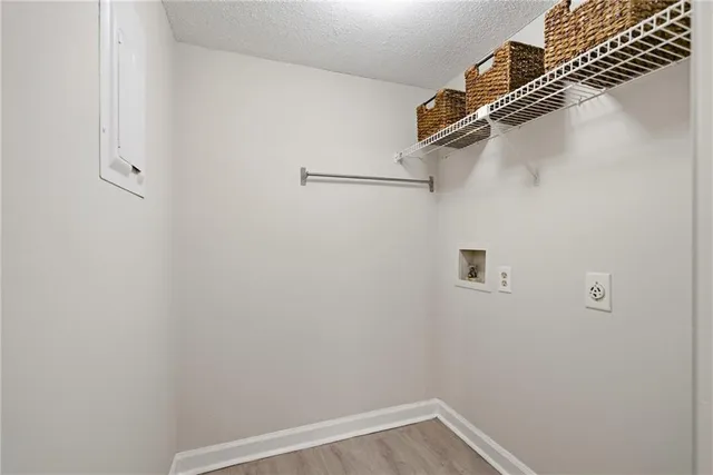 an empty room with a bathroom and a ceiling fan
