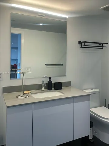 a bathroom with a sink and a toilet