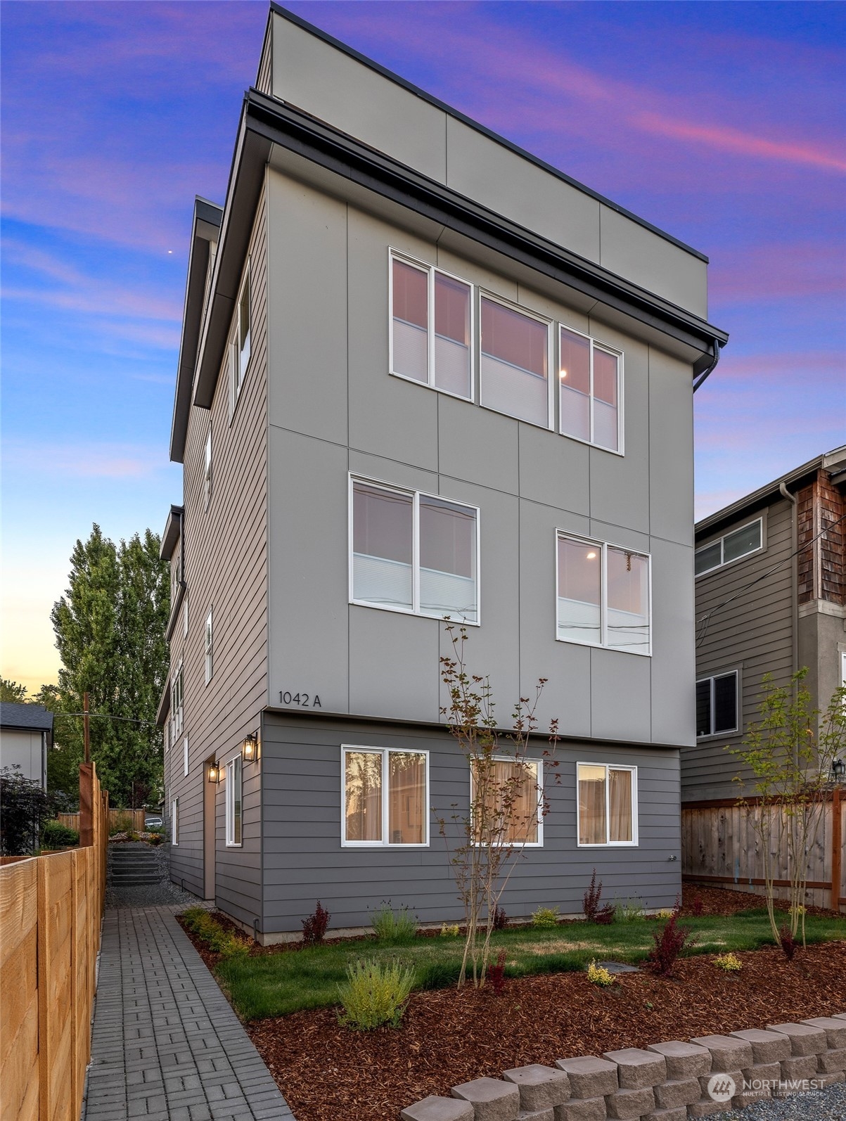 1042 South Director Street Seattle, WA 98108 - Photo 1 of 40 a front view of a house with a yard