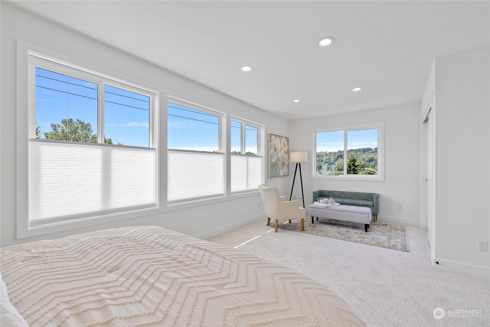 1042 South Director Street Seattle, WA 98108 - Photo 12 of 40 a spacious bedroom with a large bed and a large window