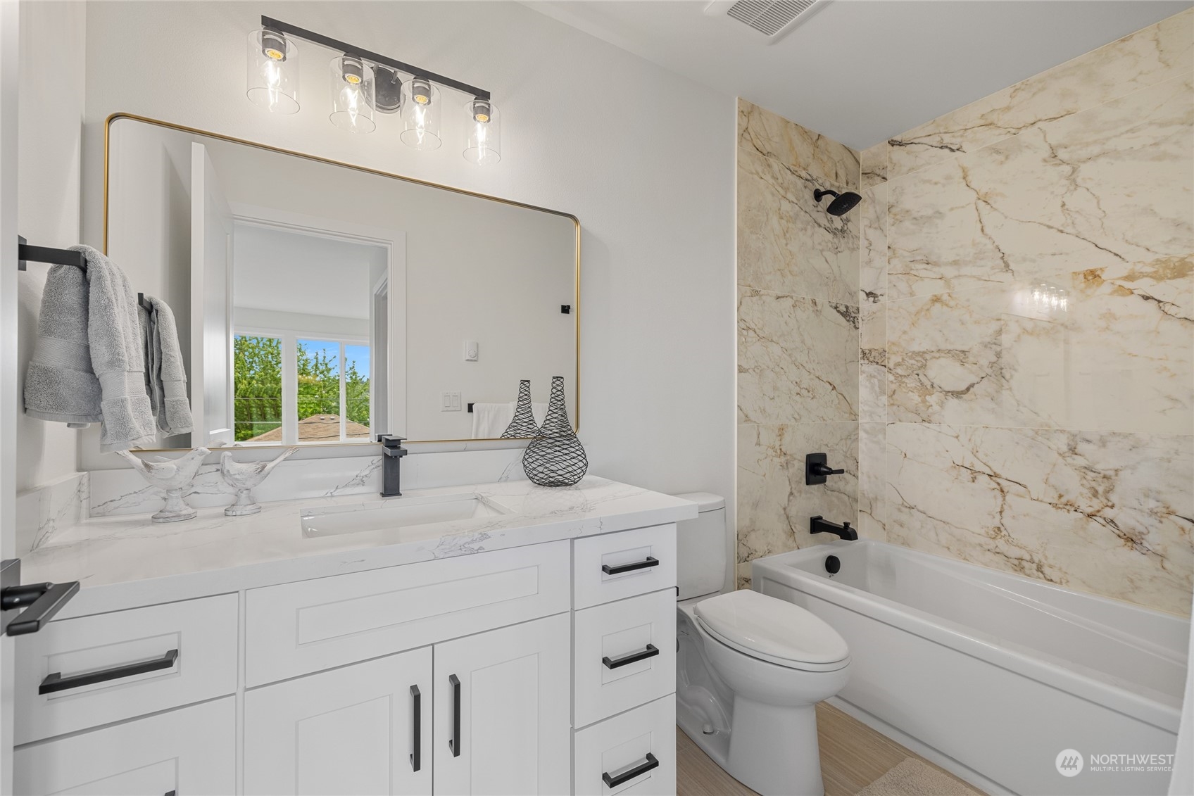 1042 South Director Street Seattle, WA 98108 - Photo 14 of 40 a bathroom with a sink a toilet and shower