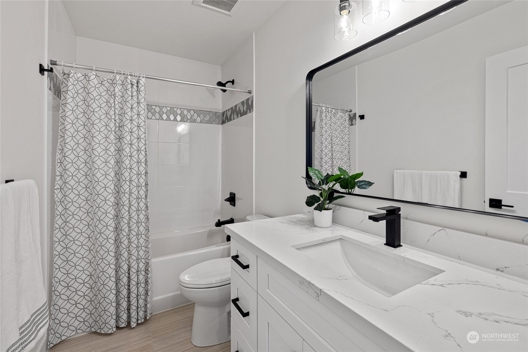 1042 South Director Street Seattle, WA 98108 - Photo 17 of 40 a bathroom with a sink a toilet and shower