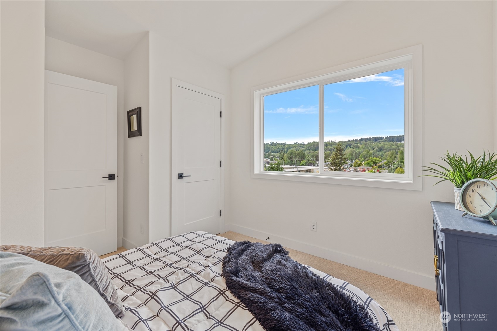 1042 South Director Street Seattle, WA 98108 - Photo 19 of 40 a bedroom with a bed and a window
