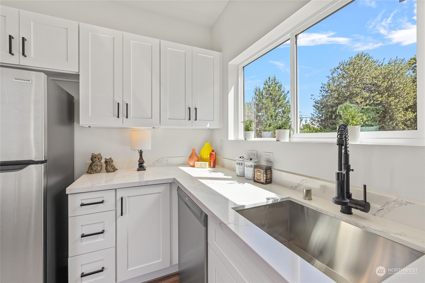 1042 South Director Street Seattle, WA 98108 - Photo 31 of 40 a kitchen with a sink cabinets and window
