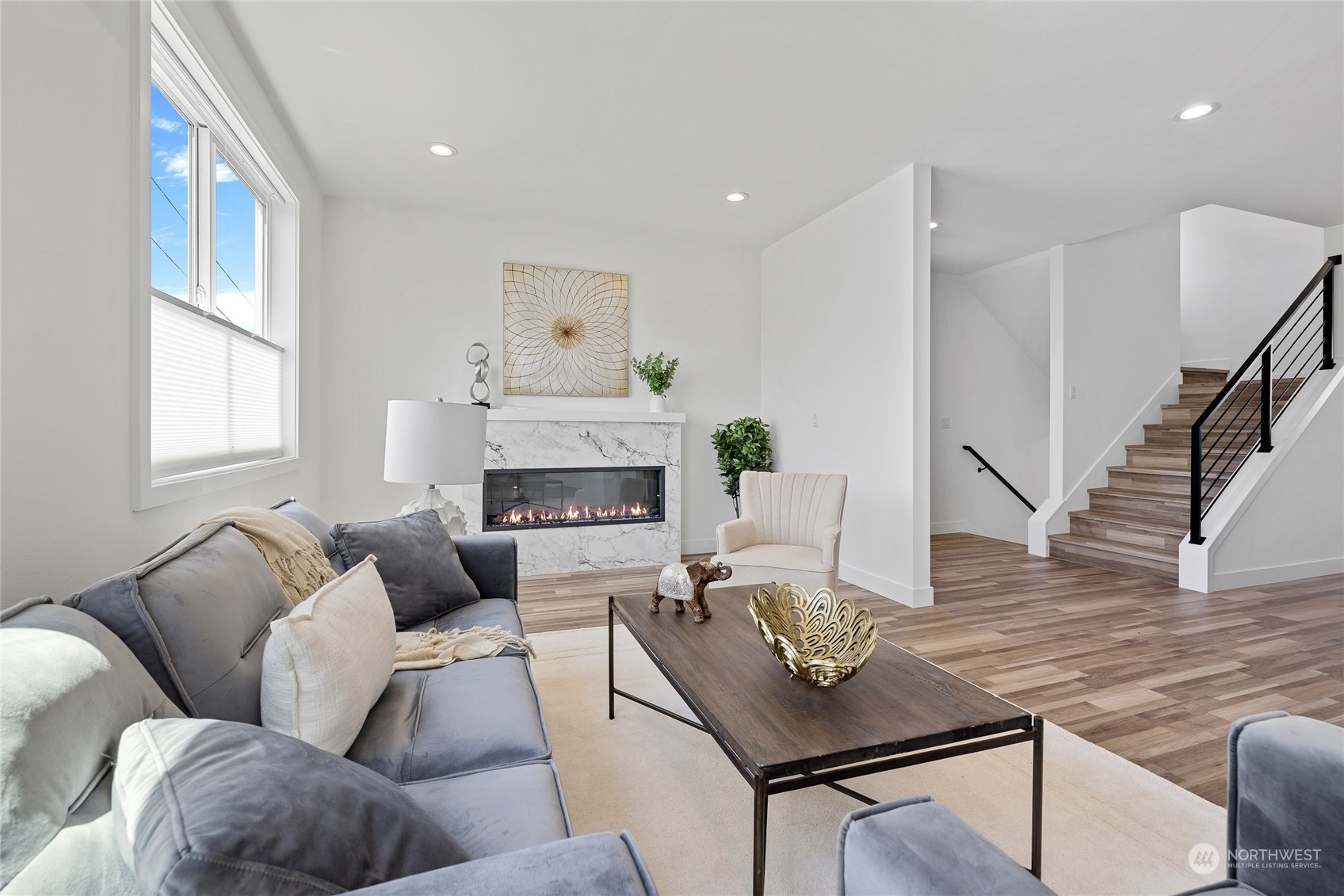 1042 South Director Street Seattle, WA 98108 - Photo 4 of 40 a living room with furniture and a fireplace