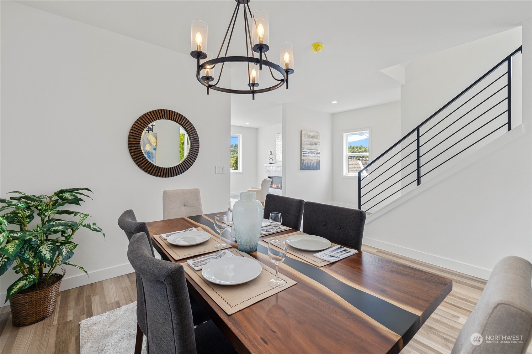 1042 South Director Street Seattle, WA 98108 - Photo 5 of 40 a view of a dining room with furniture a chandelier and wooden floor