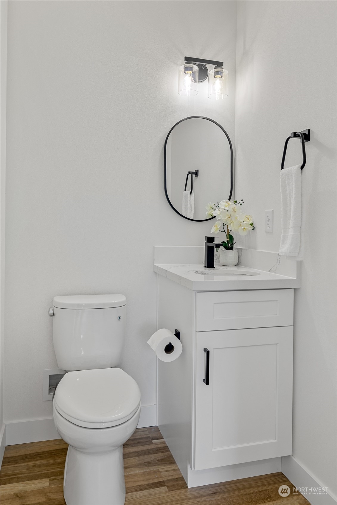 1042 South Director Street Seattle, WA 98108 - Photo 6 of 40 a bathroom with a toilet sink and mirror