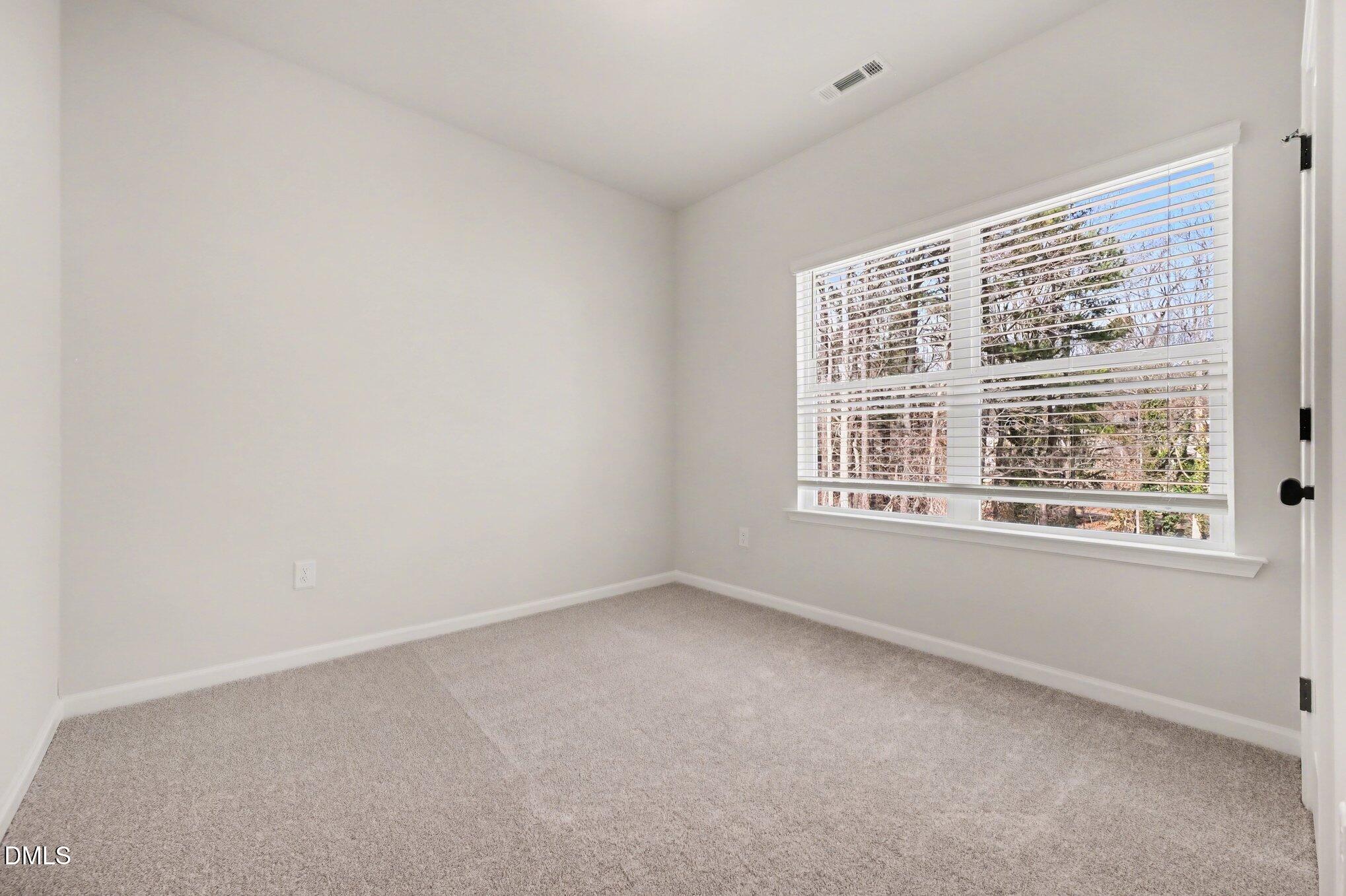 720 Orch Vista Circle Raleigh, NC 27606 - Photo 13 of 28 an empty room with a window
