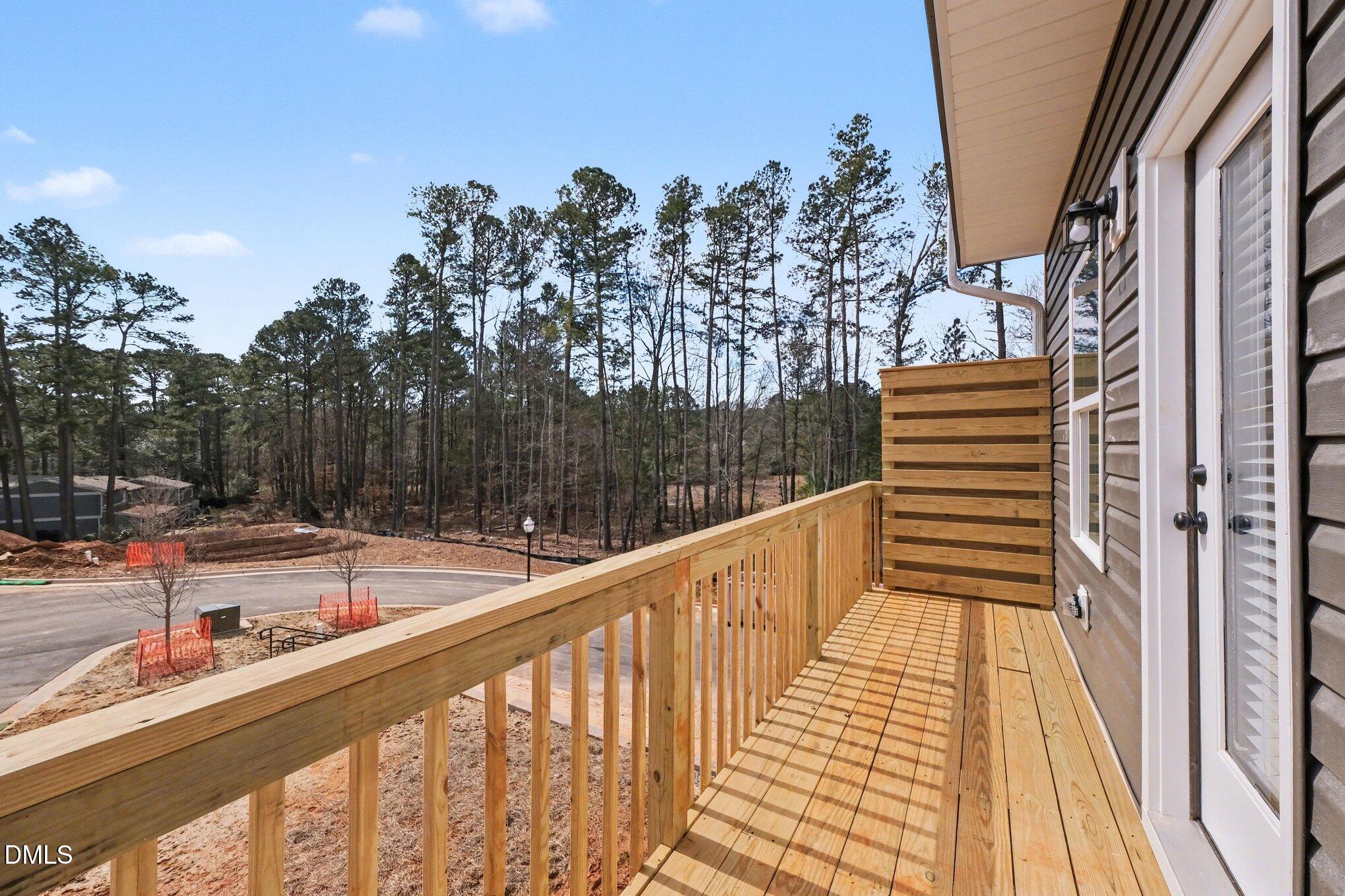 720 Orch Vista Circle Raleigh, NC 27606 - Photo 7 of 28 a view of balcony with wooden floor and fence