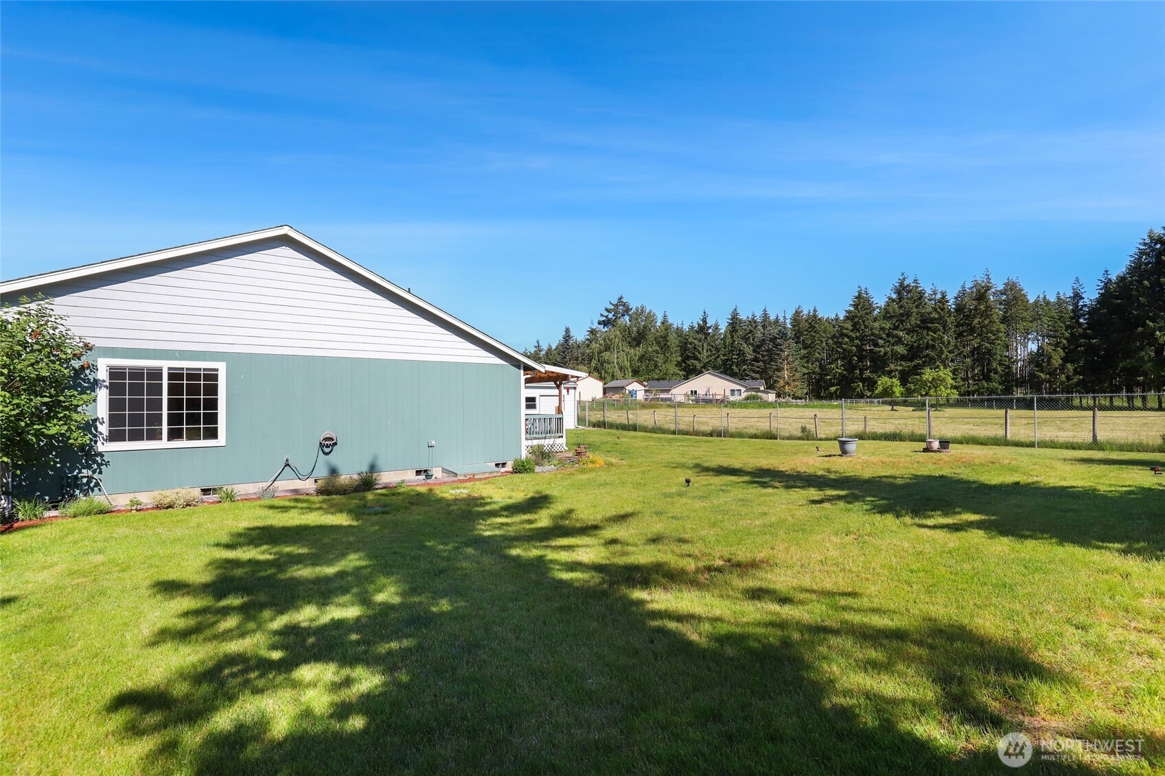 8008 188th Avenue Southwest Rochester, WA 98579 - Photo 35 of 40 a view of a house with a backyard
