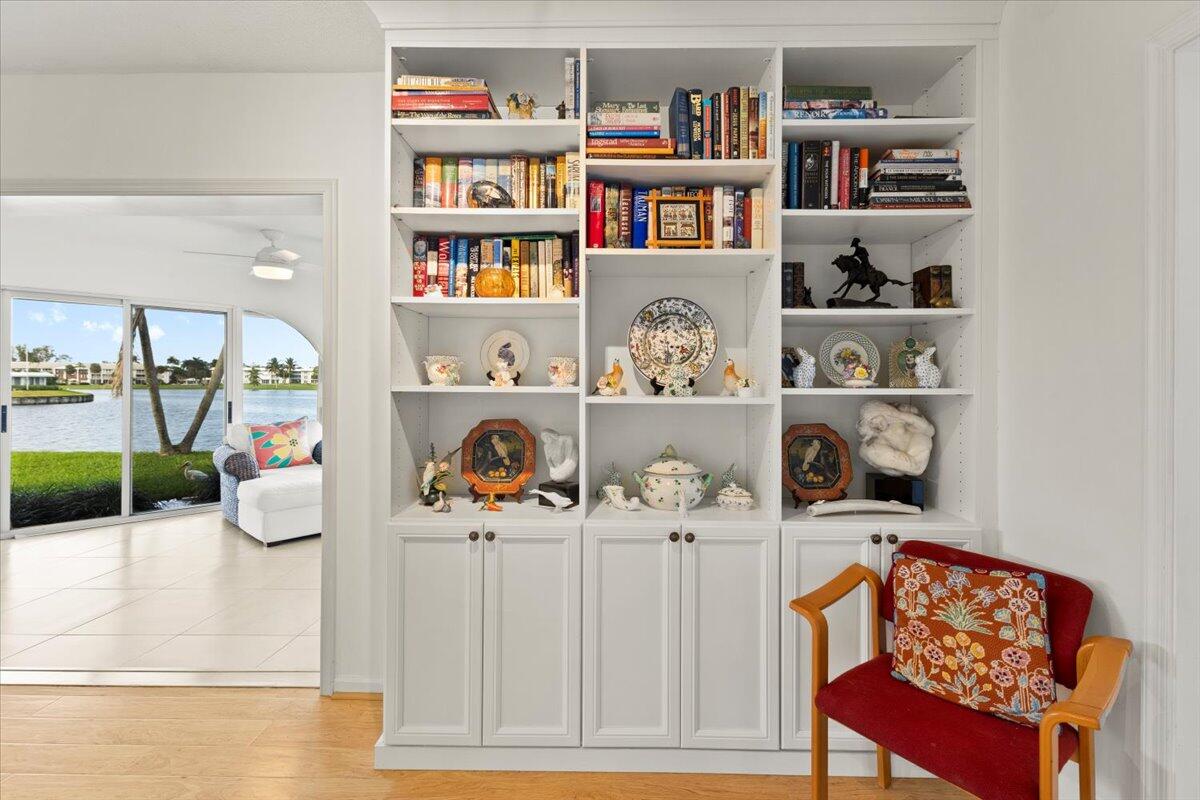 233 Rio Vista Circle, Unit 233 Atlantis, FL 33462 - Photo 12 of 33 a room with a book shelf and a book shelf